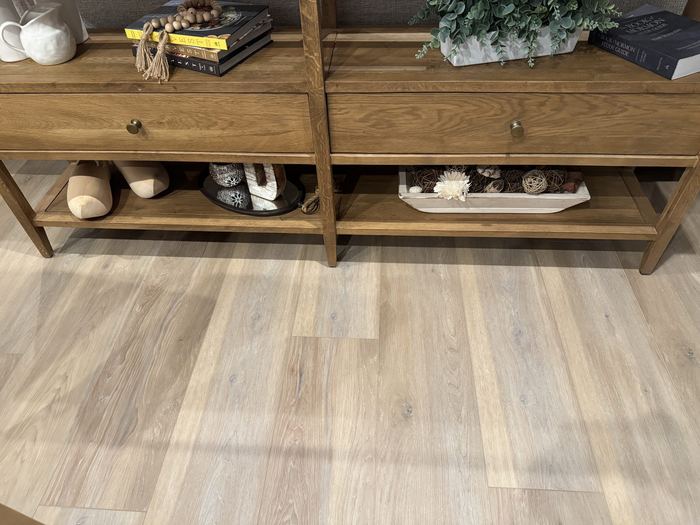 LVP flooring in an entryway beneath a styled console table